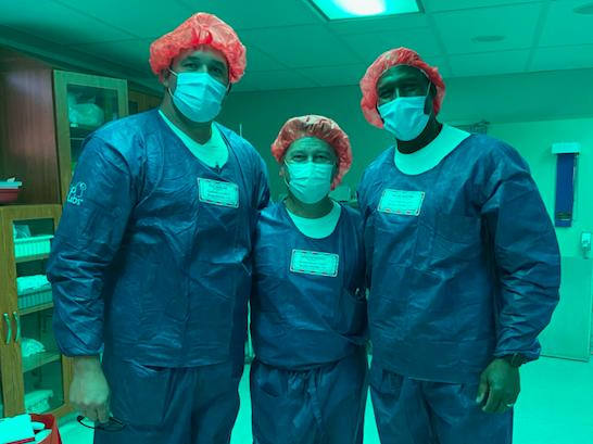 Wayne Radford poses with two Cook Medical colleagues after a physician training session. (Photos courtesy Cook Medical)